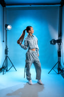 Model wearing matching denim overcoat and cargo sweatpants